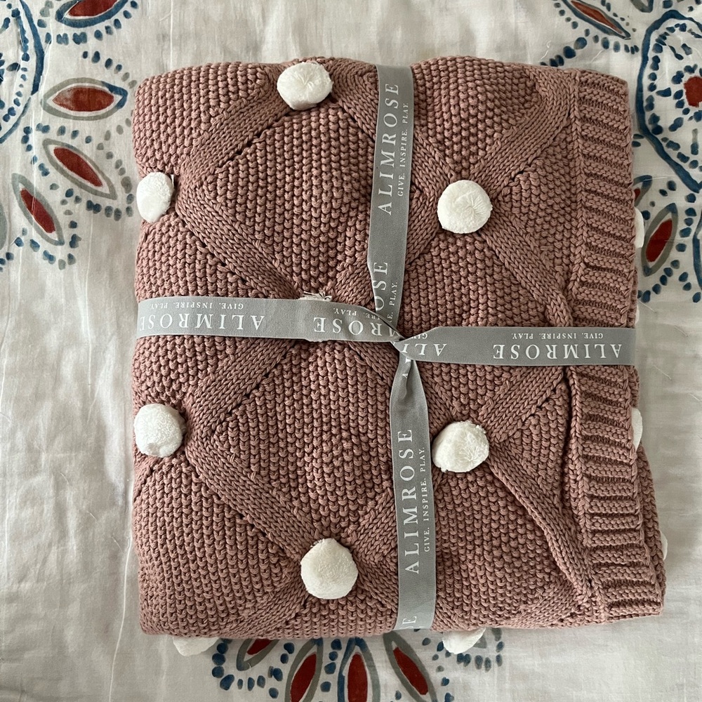 Alimrose organic pom pom knit baby blanket
